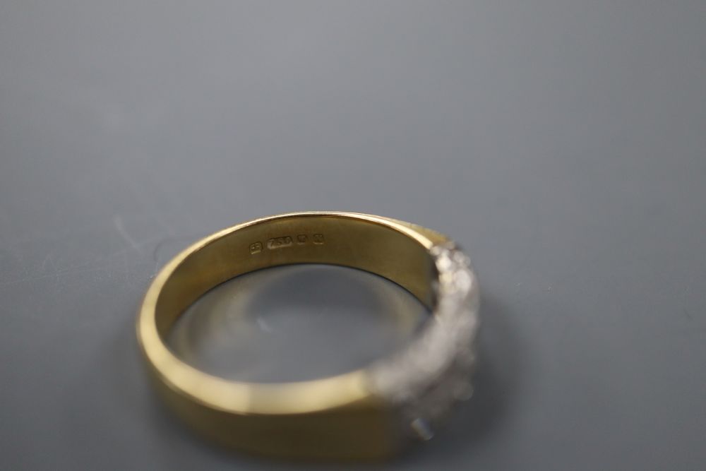 A modern 18ct gold and two row diamond half hoop ring, size J/K, gross 4.1 grams.